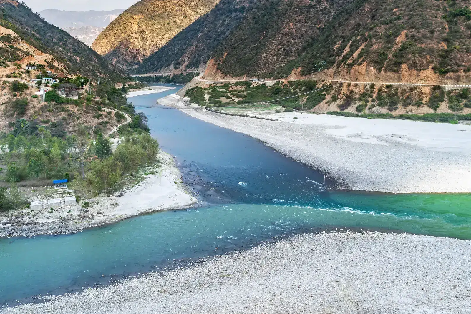 Two rivers of different colours meeting, like two partners in an ADHD relationship